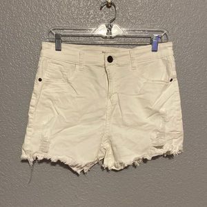 Southern Stitch white distressed raw hem denim shorts.